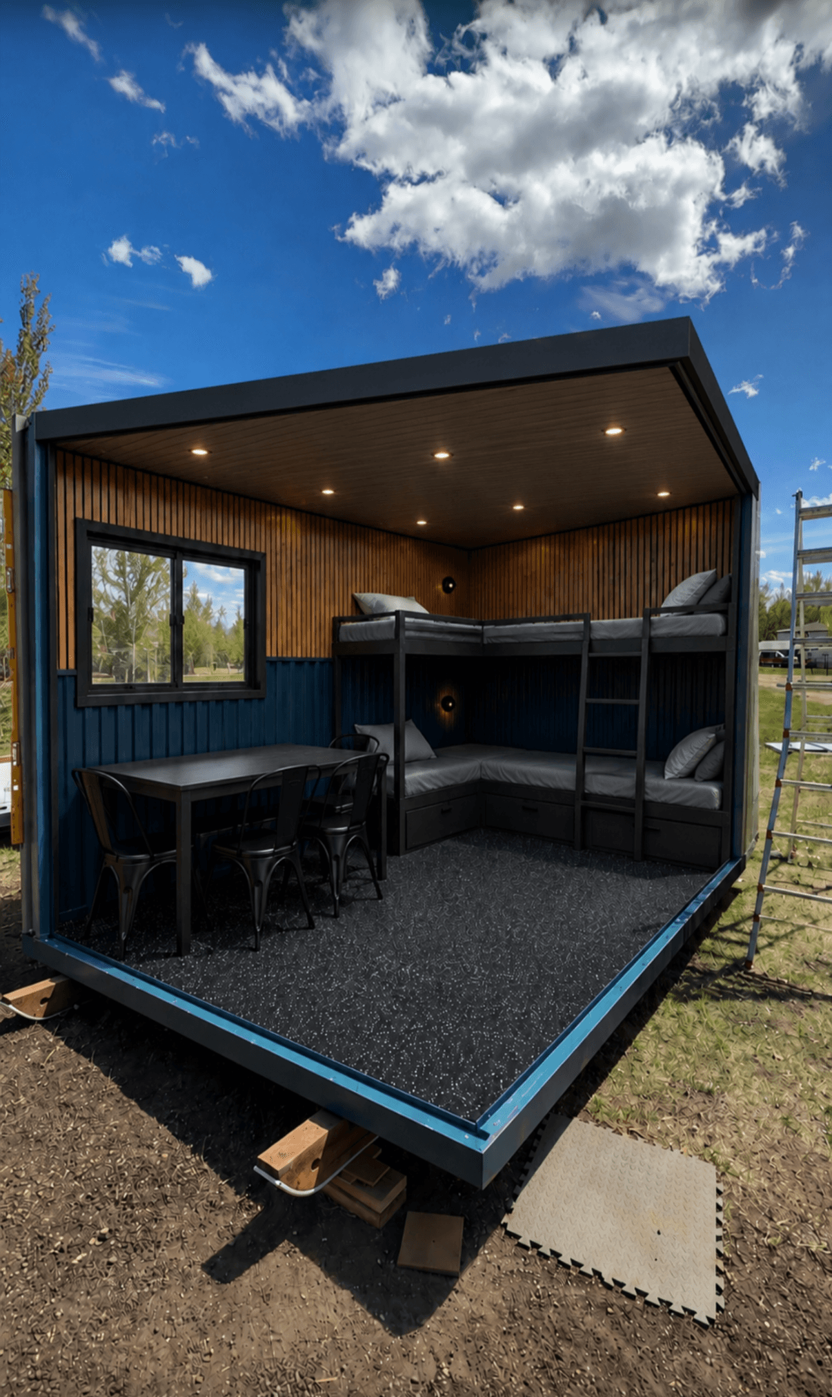 Ice shack interior with bunk beds, wood-panelled walls and recessed lighting.